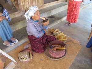 Smoking a big cigar, that´s what old ladies traditionally do in Burma